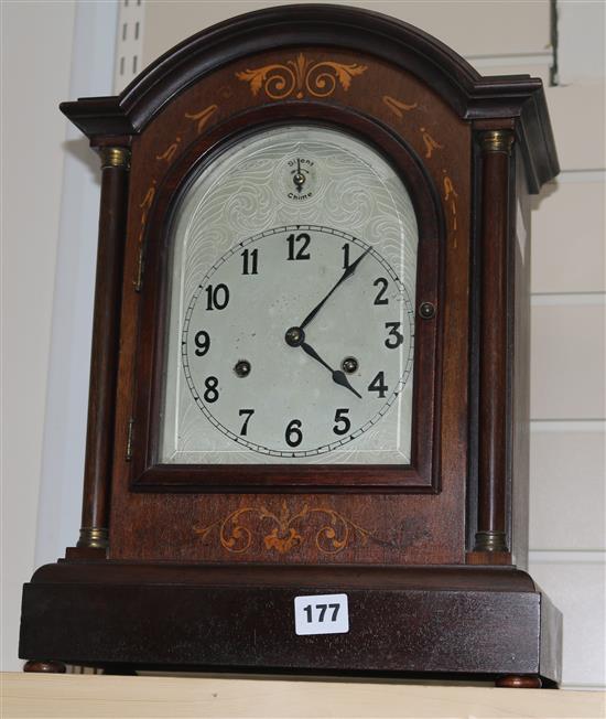 A mahogany and marquetry mantel clock